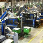 Workers on a factory assembly line in a manufacturing plant