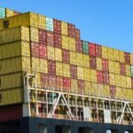 Container port terminal with cranes and shipping vessels