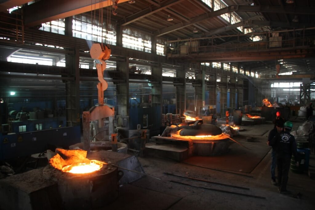 Workers at an aluminum smelter industrial facility