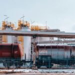 Fuel train and refinery tanks in Trzebinia, Poland, showcasing industrial energy infrastructure.
