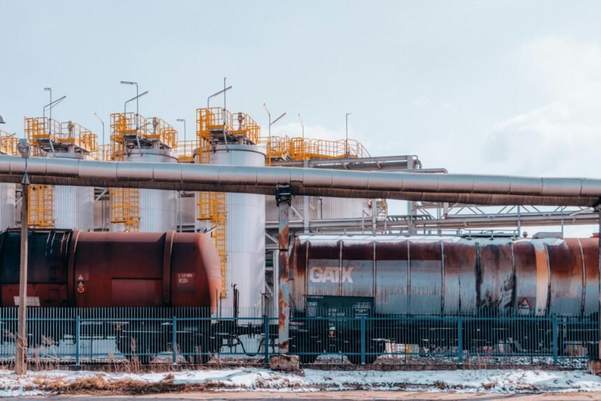 Fuel train and refinery tanks in Trzebinia, Poland, showcasing industrial energy infrastructure.