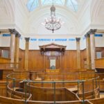 Interior view of the historic courtroom in St George's Hall, Liverpool, showcasing elegant architecture.