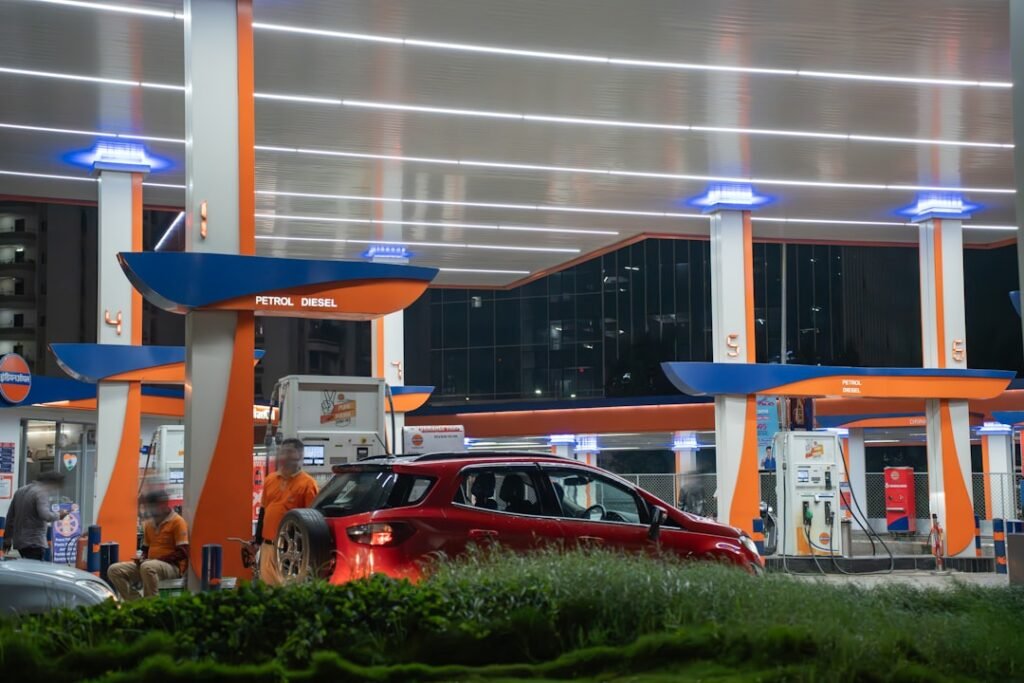 Car being filled at a petrol station fuel pump