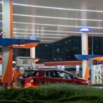 Car being filled at a petrol station fuel pump
