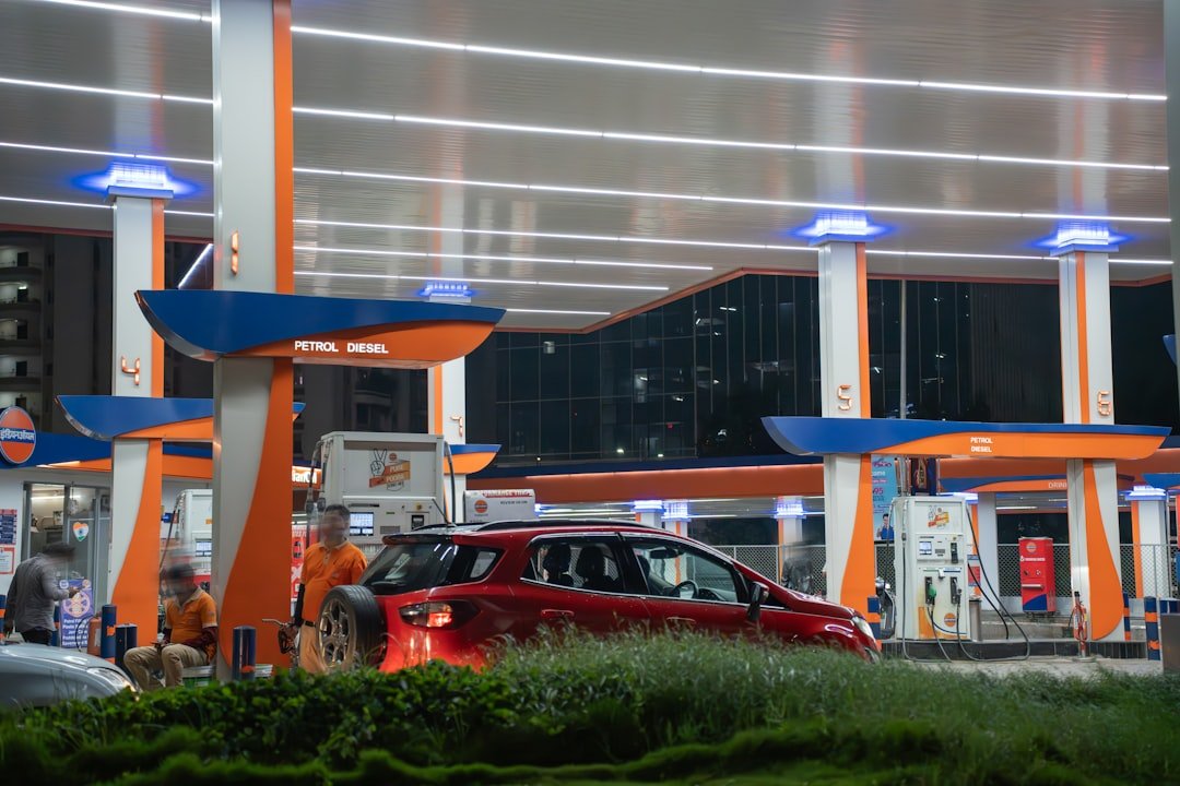 Car being filled at a petrol station fuel pump