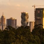 a view of a city with tall buildings in the background