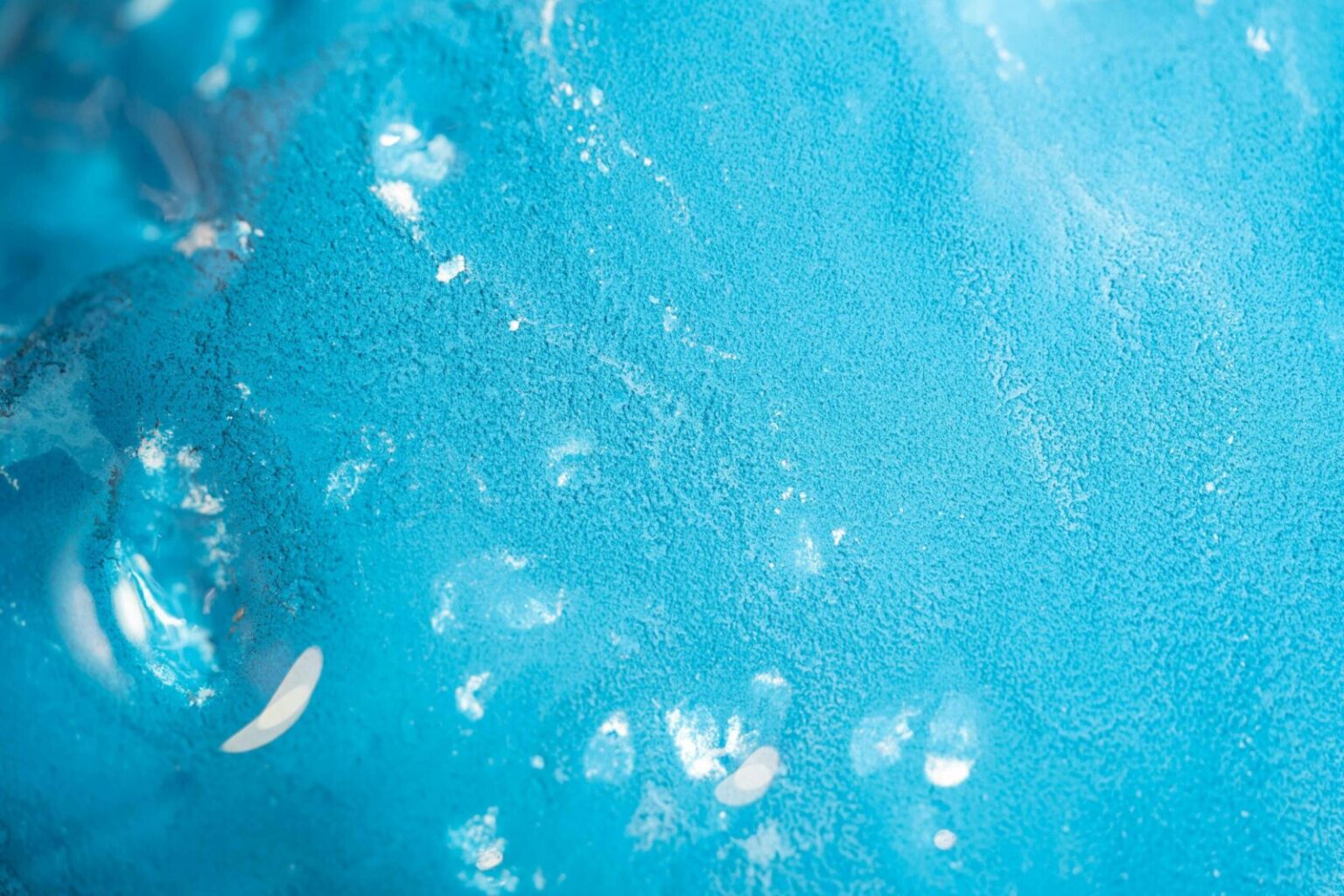 A detailed view of a vibrant blue textured abstract surface, capturing the essence of modern art.