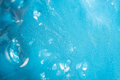 A detailed view of a vibrant blue textured abstract surface, capturing the essence of modern art.