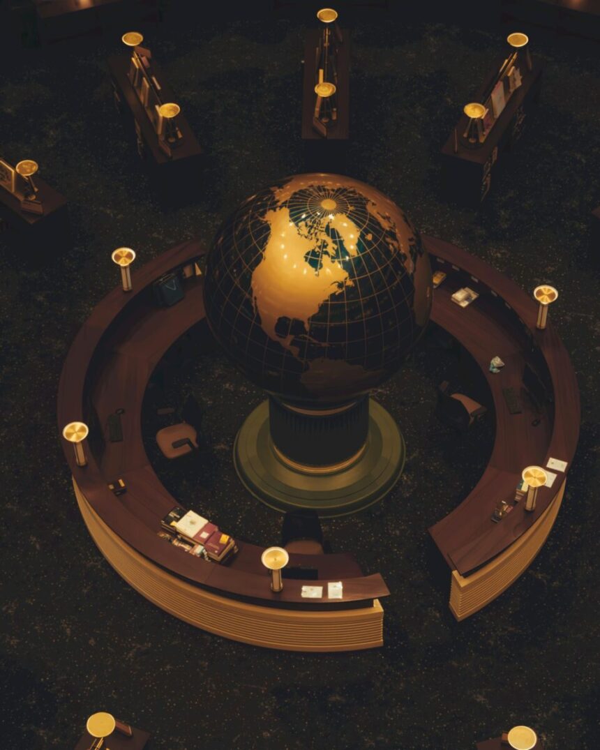 Aerial view of a glowing globe at a circular reception desk with ambient lighting.
