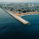Aerial shot capturing the coastline and urban sprawl of Abidjan, Côte d'Ivoire.