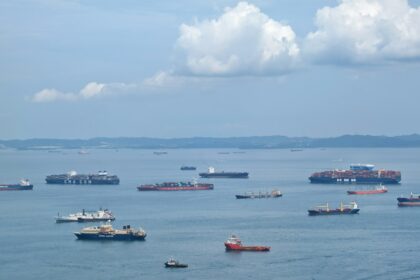 A large body of water filled with lots of boats