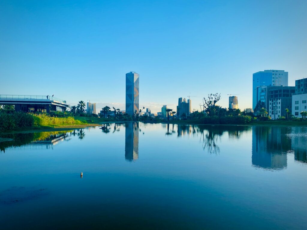 body of water near city buildings during daytime