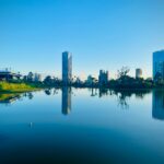 body of water near city buildings during daytime