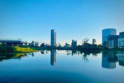 body of water near city buildings during daytime