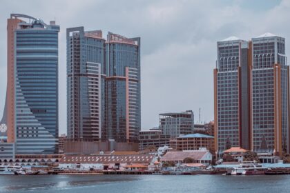 body of water near buildings at daytime