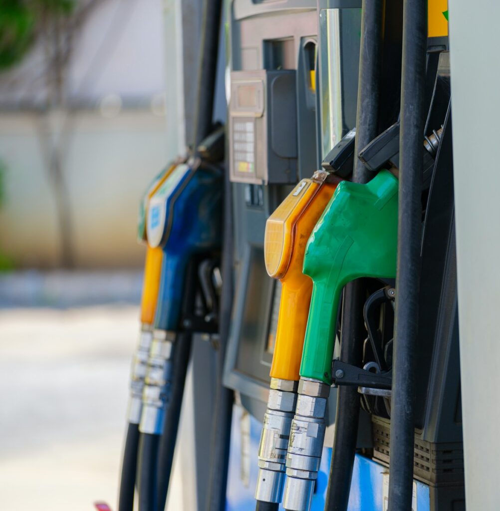 a row of gas pumps filled with gas
