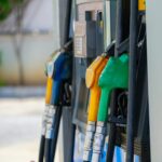 a row of gas pumps filled with gas