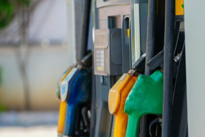 a row of gas pumps filled with gas