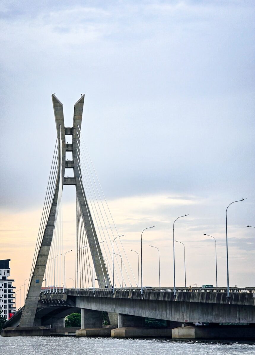 A very tall bridge over a large body of water