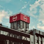 a large red sign on top of a building