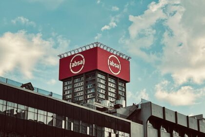 a large red sign on top of a building