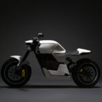 white and black motorcycle with black background